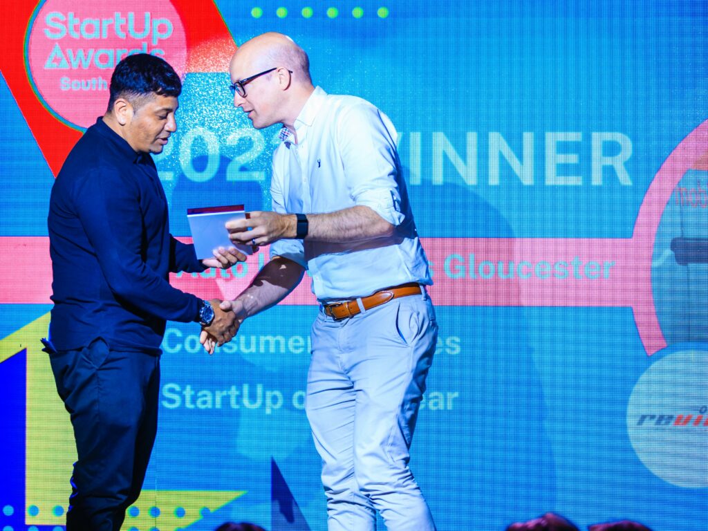 Jai Patel of Revive! Gloucester, picking up his Consumer sevices StartUp of the year award