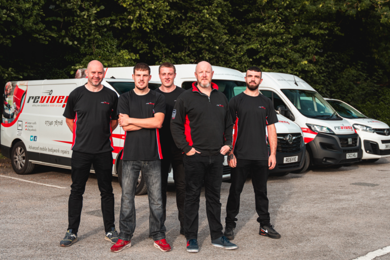 Scott and the team from Revive Stoke stood in front of their vans